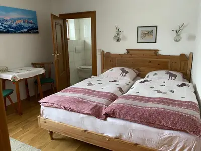 Ein Bett oder Betten in einem Zimmer der Unterkunft Haus Jochbergerstrasse 116