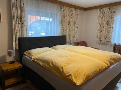Ein Bett oder Betten in einem Zimmer der Unterkunft Haus Jochbergerstrasse 116