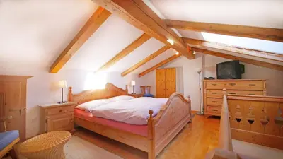 Ein Bett oder Betten in einem Zimmer der Unterkunft Haus Jochbergerstrasse 116