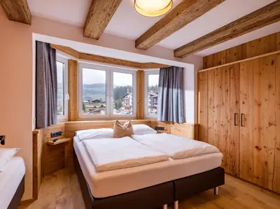 Ein Bett oder Betten in einem Zimmer der Unterkunft Almhof Kitzlodge - Alpine Lifestyle Hotel