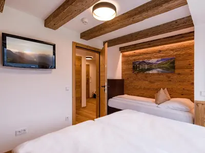 Ein Bett oder Betten in einem Zimmer der Unterkunft Almhof Kitzlodge - Alpine Lifestyle Hotel