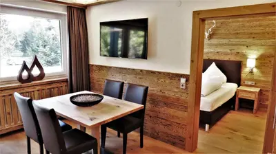 Ein Bett oder Betten in einem Zimmer der Unterkunft Almhof Kitzlodge - Alpine Lifestyle Hotel