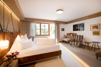 Ein Bett oder Betten in einem Zimmer der Unterkunft Geniesserhotel Minglers Sportalm 4 Sterne Superior