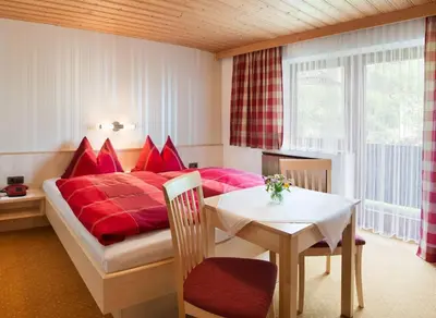 Ein Bett oder Betten in einem Zimmer der Unterkunft Gästehaus Hofer