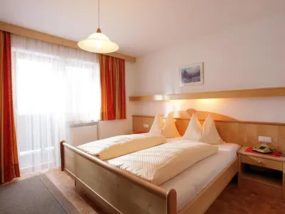 Ein Bett oder Betten in einem Zimmer der Unterkunft Gästehaus Hofer
