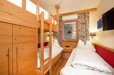 Ein Bett oder Betten in einem Zimmer der Unterkunft Chalet in Königsleiten with Mountain Views & Spa