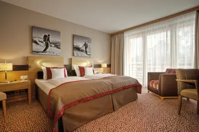 Ein Bett oder Betten in einem Zimmer der Unterkunft aja Fürstenhaus am Achensee