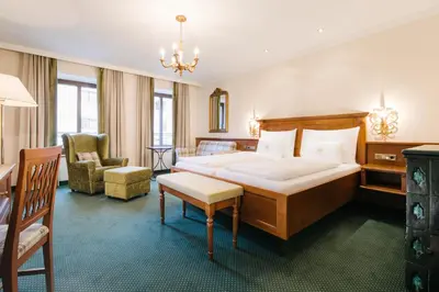 Ein Bett oder Betten in einem Zimmer der Unterkunft Hotel Bräu