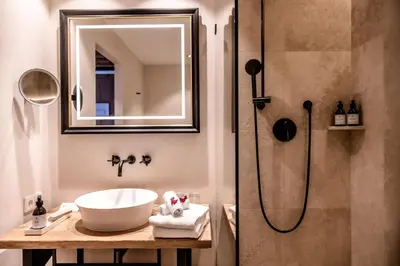 Ein Badezimmer in der Unterkunft Kitzhof Mountain Design Resort, 4 Sterne Superior