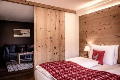 Ein Bett oder Betten in einem Zimmer der Unterkunft Kitzhof Mountain Design Resort, 4 Sterne Superior