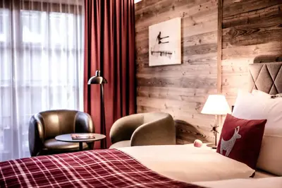 Ein Bett oder Betten in einem Zimmer der Unterkunft Kitzhof Mountain Design Resort, 4 Sterne Superior