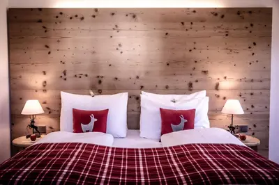 Ein Bett oder Betten in einem Zimmer der Unterkunft Kitzhof Mountain Design Resort, 4 Sterne Superior