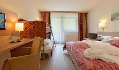 Ein Bett oder Betten in einem Zimmer der Unterkunft Familienhotel Christoph