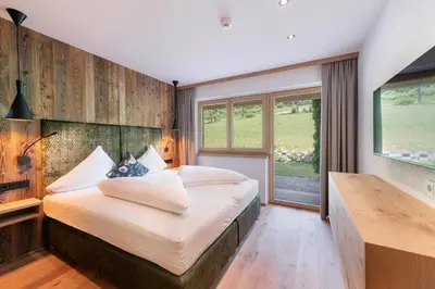 Ein Bett oder Betten in einem Zimmer der Unterkunft Hotel AlpenSchlössl