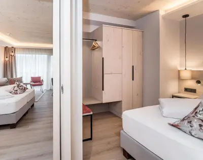 Ein Bett oder Betten in einem Zimmer der Unterkunft Aktivhotel Schweizerhof Kitzbühel