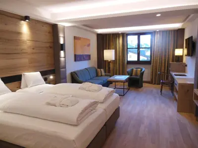Ein Bett oder Betten in einem Zimmer der Unterkunft Hotel Tiefenbrunner