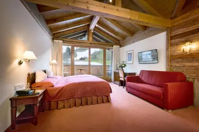 Ein Bett oder Betten in einem Zimmer der Unterkunft Rasmushof - Hotel Kitzbühel