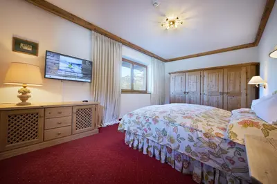 Ein Bett oder Betten in einem Zimmer der Unterkunft Rasmushof - Hotel Kitzbühel