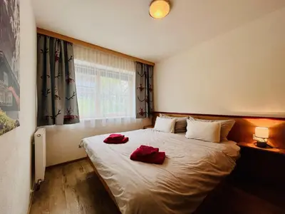 Ein Bett oder Betten in einem Zimmer der Unterkunft Ferienwohnung Buchau