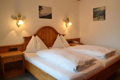 Ein Bett oder Betten in einem Zimmer der Unterkunft Hotel Aurach
