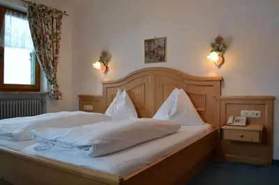 Ein Bett oder Betten in einem Zimmer der Unterkunft Hotel Aurach