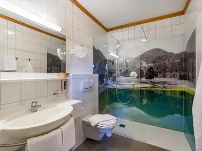 Ein Badezimmer in der Unterkunft Hotel Alpenpanorama