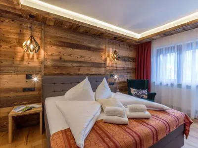 Ein Bett oder Betten in einem Zimmer der Unterkunft Tennenwirt Hotel