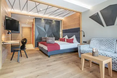 Ein Bett oder Betten in einem Zimmer der Unterkunft Hotel Salzburger Hof Leogang