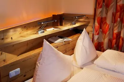 Ein Bett oder Betten in einem Zimmer der Unterkunft Hotel Flatscher