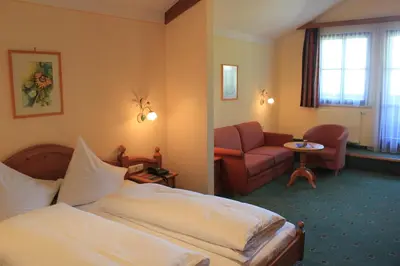 Ein Bett oder Betten in einem Zimmer der Unterkunft Hotel Flatscher