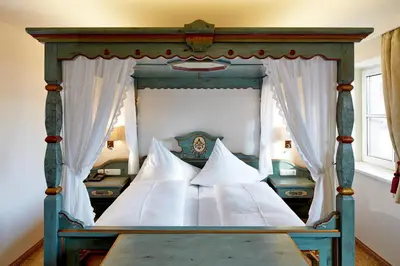 Ein Bett oder Betten in einem Zimmer der Unterkunft Hotel Flatscher