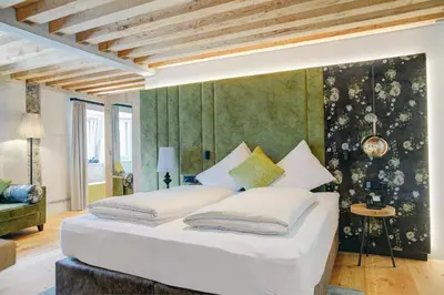 Ein Bett oder Betten in einem Zimmer der Unterkunft Boutique Hotel im Auracher Löchl