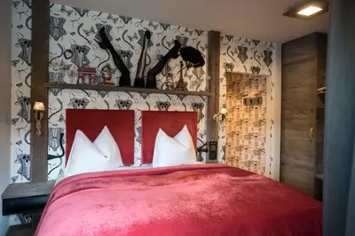 Ein Bett oder Betten in einem Zimmer der Unterkunft Boutique Hotel im Auracher Löchl