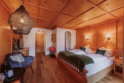 Ein Bett oder Betten in einem Zimmer der Unterkunft Hotel Glücksschmiede - Hinterglemm