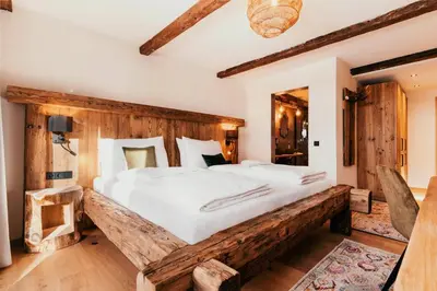 Ein Bett oder Betten in einem Zimmer der Unterkunft Hotel Glücksschmiede - Hinterglemm