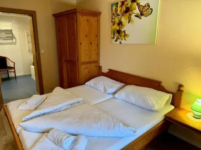 Ein Bett oder Betten in einem Zimmer der Unterkunft Alpenlodge, Ferienwohnung 2