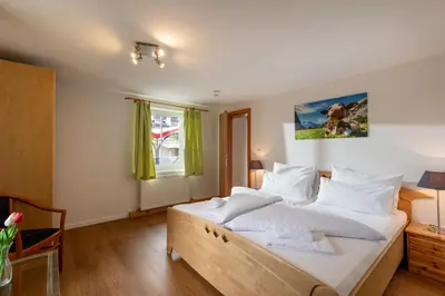 Ein Bett oder Betten in einem Zimmer der Unterkunft Alpenlodge, Ferienwohnung 8
