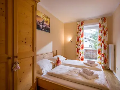 Ein Bett oder Betten in einem Zimmer der Unterkunft Alpenlodge, Ferienwohnung 11