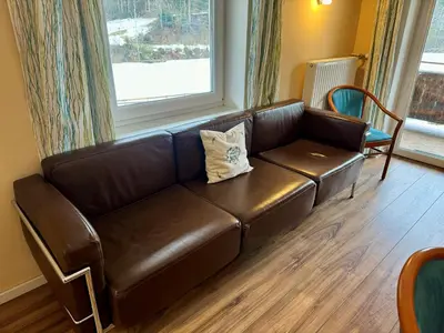 Ein Sitzbereich in der Unterkunft Alpenlodge, Ferienwohnung 12