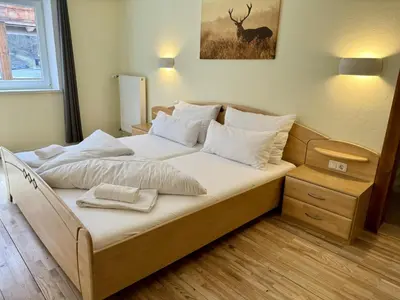 Ein Bett oder Betten in einem Zimmer der Unterkunft Alpenlodge, Ferienwohnung 13