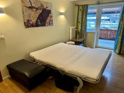 Ein Bett oder Betten in einem Zimmer der Unterkunft Alpenlodge, Ferienwohnung 13