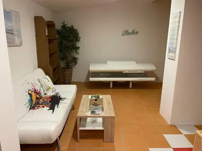 Ein Sitzbereich in der Unterkunft Alpenlodge, Ferienwohnung 14