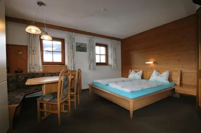 Ein Bett oder Betten in einem Zimmer der Unterkunft Wimmers Hundsegghof WILD002