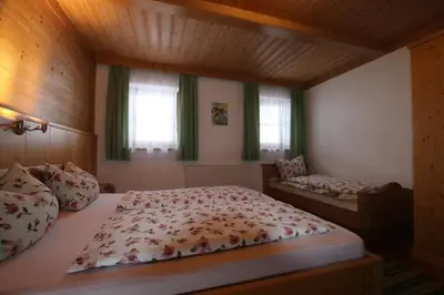 Ein Bett oder Betten in einem Zimmer der Unterkunft Wimmers Hundsegghof WILD002