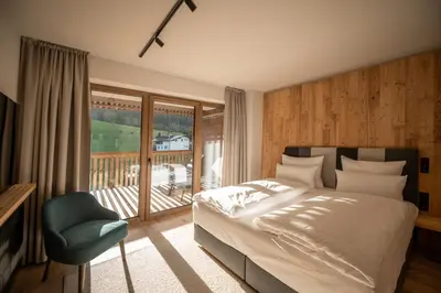 Ein Bett oder Betten in einem Zimmer der Unterkunft ADEA Lifestyle Suites Fieberbrunn