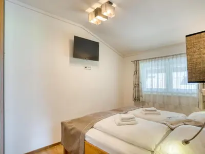 Ein Bett oder Betten in einem Zimmer der Unterkunft Apartment building Ferien, Neukirchen