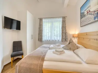 Ein Bett oder Betten in einem Zimmer der Unterkunft Apartment building Ferien, Neukirchen