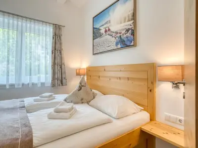 Ein Bett oder Betten in einem Zimmer der Unterkunft Apartment building Ferien, Neukirchen