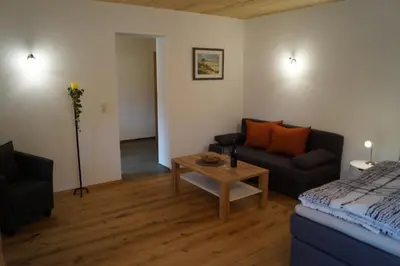 Ein Sitzbereich in der Unterkunft Ferienwohnungen Tischlerhof