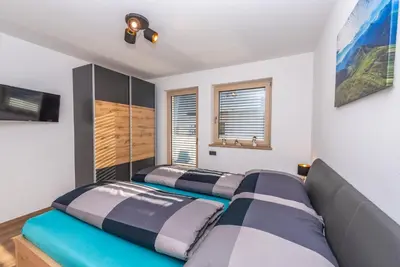 Ein Bett oder Betten in einem Zimmer der Unterkunft Apart Melanie